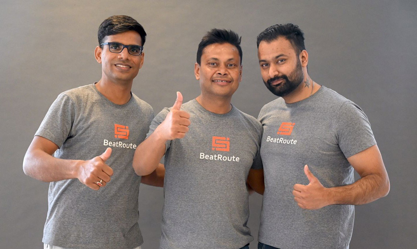 Three BeatRoute employees give thumbs up. Global SaaS.